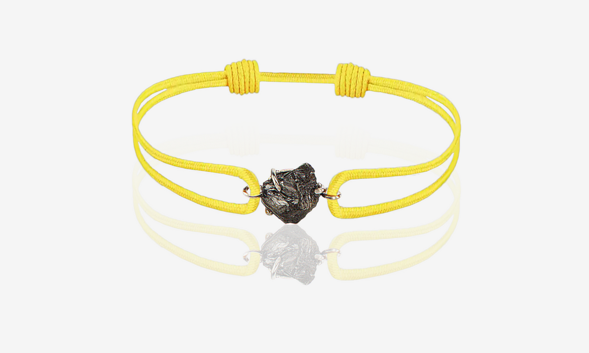 Natural Rough Diamond 1.53 carat. White gold. Yellow cord bracelet