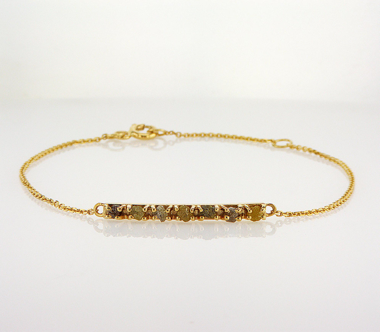 Natural Fancy Color Rough Diamonds 0.55 carat. Yellow gold bracelet bar