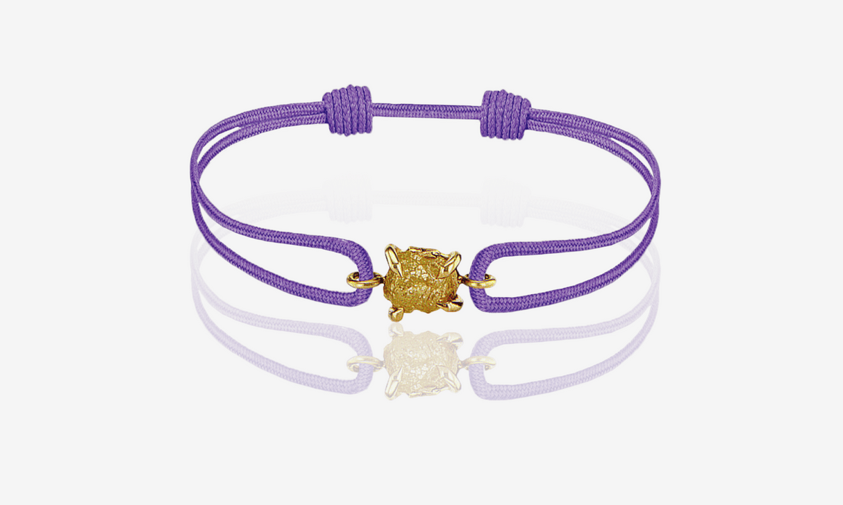 Natural Yellow Rough Diamond 0.53 carat. Yellow gold. Purple cord bracelet